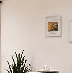 Framed 'Confidence Looks Good On You' art on the reception wall
